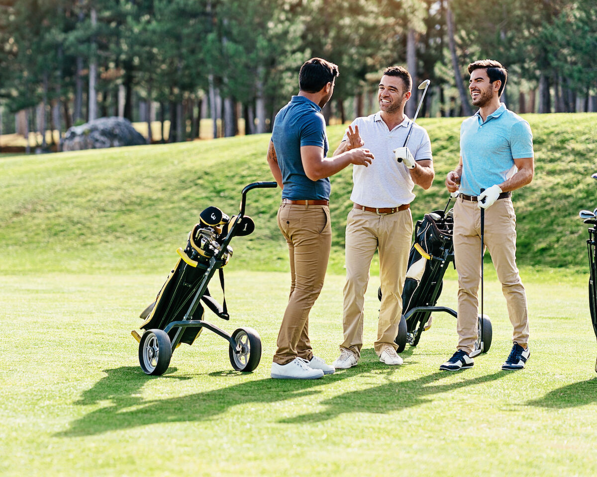 Photo: golfing with three people betting